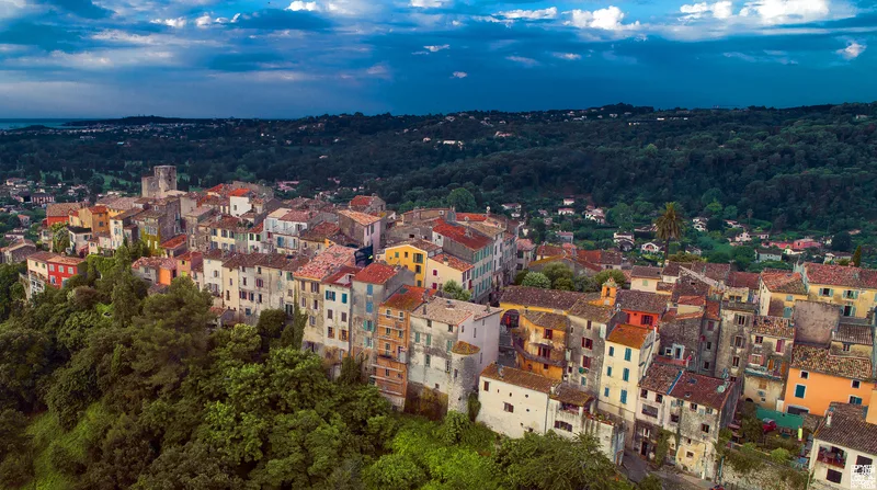 Aerial view of Biot village, Alpes-Maritimes — the colourful medieval hilltop town sits surrounded by Mediterranean greenery, just minutes from Sophia Antipolis technology park