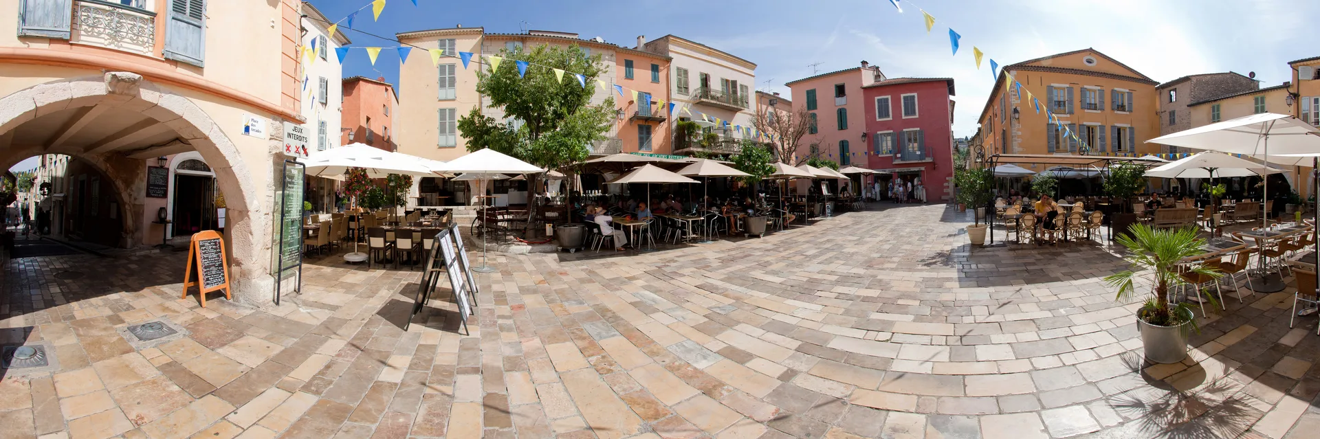 Place des Arcades, the heart of historic Valbonne, with arcaded walkways and Mediterranean character